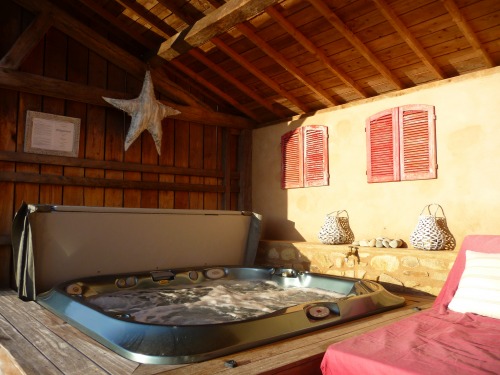 Jacuzzi spa under lean-to