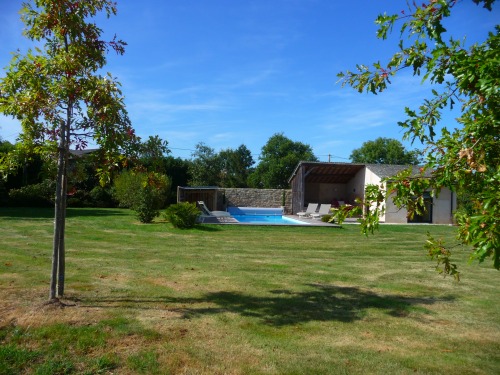 the swimming pool and the relaxation area seen from the garden